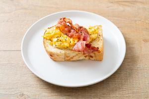 Bread toast with scramble egg and bacon photo