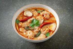 Spicy boiled pork soup with mushroom - Tom Yum photo