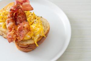 Bread toast with scramble egg and bacon photo