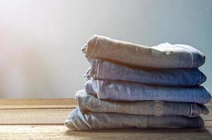 Blue jean and jean lack texture on table, Jeans are overlapping. photo