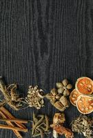 Dried herbs and dried bael fruit, Slices of bael fruit on table. photo