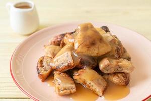 Grilled bananas with coconut caramel sauce photo