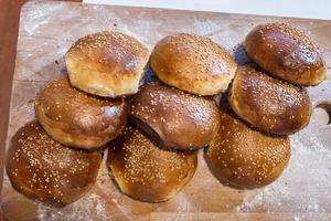 Homemade bread on table with light white flour. photo