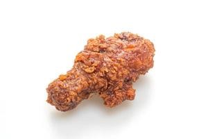 Fried chicken with spicy Korean sauce on white background photo