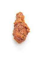 Fried chicken with spicy Korean sauce on white background photo