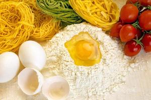 Ingredients for preparation of homemade egg pasta photo