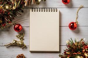 A notebook placed on a wooden background with giftshop photo