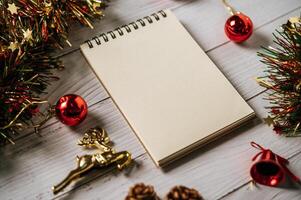 A notebook placed on a wooden background with giftshop photo