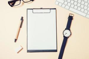 White office desk table with a lot of things on it photo