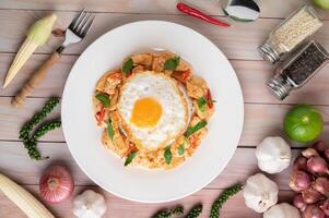 Stir fried chili paste with chicken and rice fried eggs photo