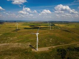 Wind turbines at the countryside in summer day, aerial view photo