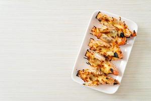 Grilled river prawns or shrimps with cheese photo