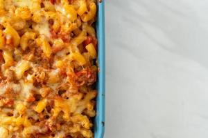 Homemade macaroni bolognese with cheese photo