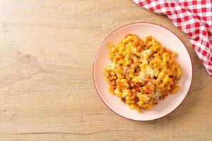 Homemade macaroni bolognese with cheese photo