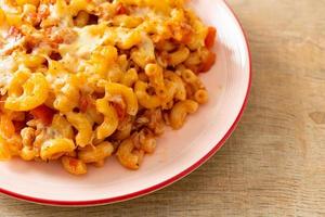 Homemade macaroni bolognese with cheese photo