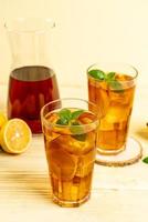Glass of ice lemon tea photo