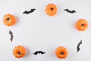 Produce pumpkins, autumn leaves on wood table photo