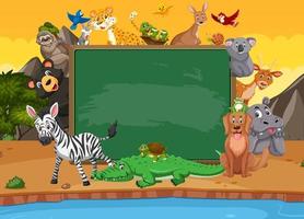 Empty blackboard with various wild animals in the forest vector