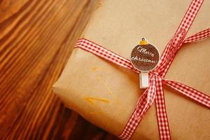 Gift box on wooden table photo