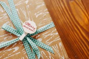 Gift box on wooden table photo