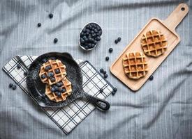 Belgium waffle with blueberry on pan photo