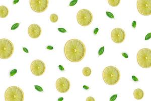 Raw material with lemon slice, basil leaves on white background. photo