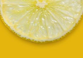 Lemon and lime slice and fresh citrus fruit on yellow background. photo