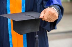 Close up Graduation holding graduation cap education concept