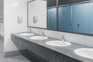 Public toilet and Bathroom interior with wash basin and toilet room. photo