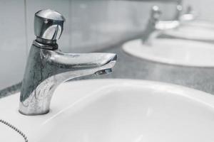 Public toilet and Bathroom interior with wash basin and toilet room. photo