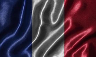 papel pintado de la bandera de Francia y bandera ondeante de la tela. foto