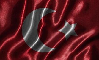 papel tapiz con la bandera de Turquía y bandera ondeando con la tela. foto