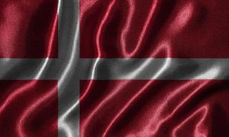 papel pintado de la bandera de Dinamarca y bandera ondeando por la tela. foto