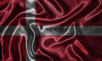 papel pintado de la bandera de Dinamarca y bandera ondeando por la tela. foto