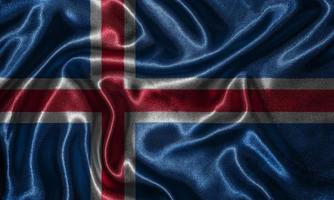 papel pintado de la bandera de islandia y bandera ondeando por tela. foto