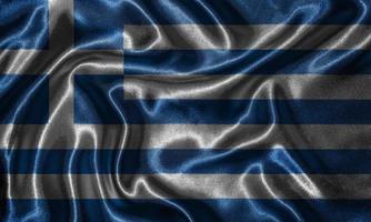 papel pintado de la bandera de Grecia y bandera ondeando por la tela. foto