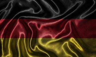 papel pintado de la bandera de Alemania y bandera ondeando por la tela. foto