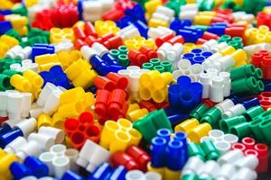Multicolored plastic building blocks as a background texture