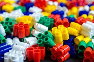 Multicolored plastic building blocks as a background texture photo