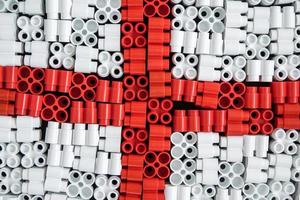 plastic bricks that form the flag of England on the background