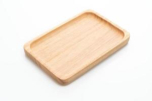 Wooden tray or plate on white background photo