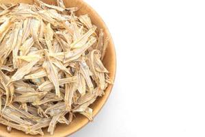 Dried small crispy fish on white background photo