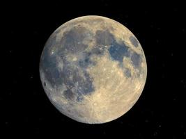 Full moon seen with telescope, starry sky photo
