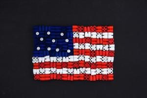 plastic bricks which form the US flag on black background photo