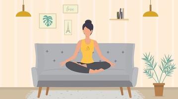 The woman is meditating sitting in the lotus pose on the sofa vector