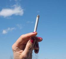 Cigarette with blue sky photo