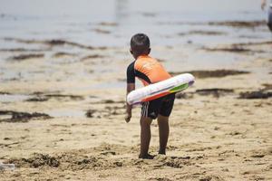 Sorong, Indonesia 2021- A kid playing photo