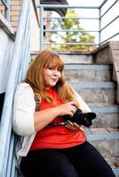 Plus size woman photographer outdoors photo