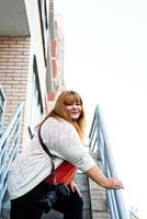 Plus size woman photographer outdoors photo