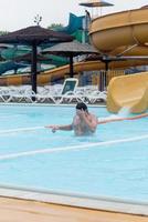 Man on a water slide photo